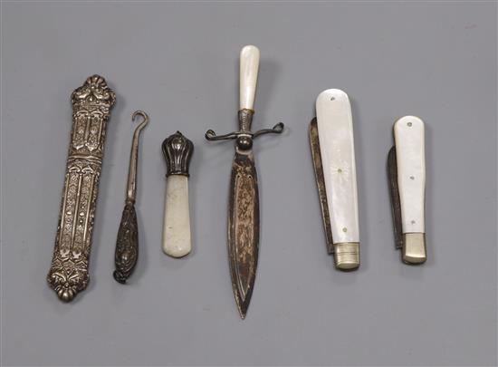 A silver and mother opearl book mark, two silver and mother opearl fruit knives and two other pieces.